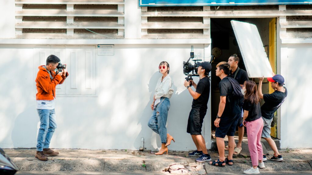 group of people with camera on film set